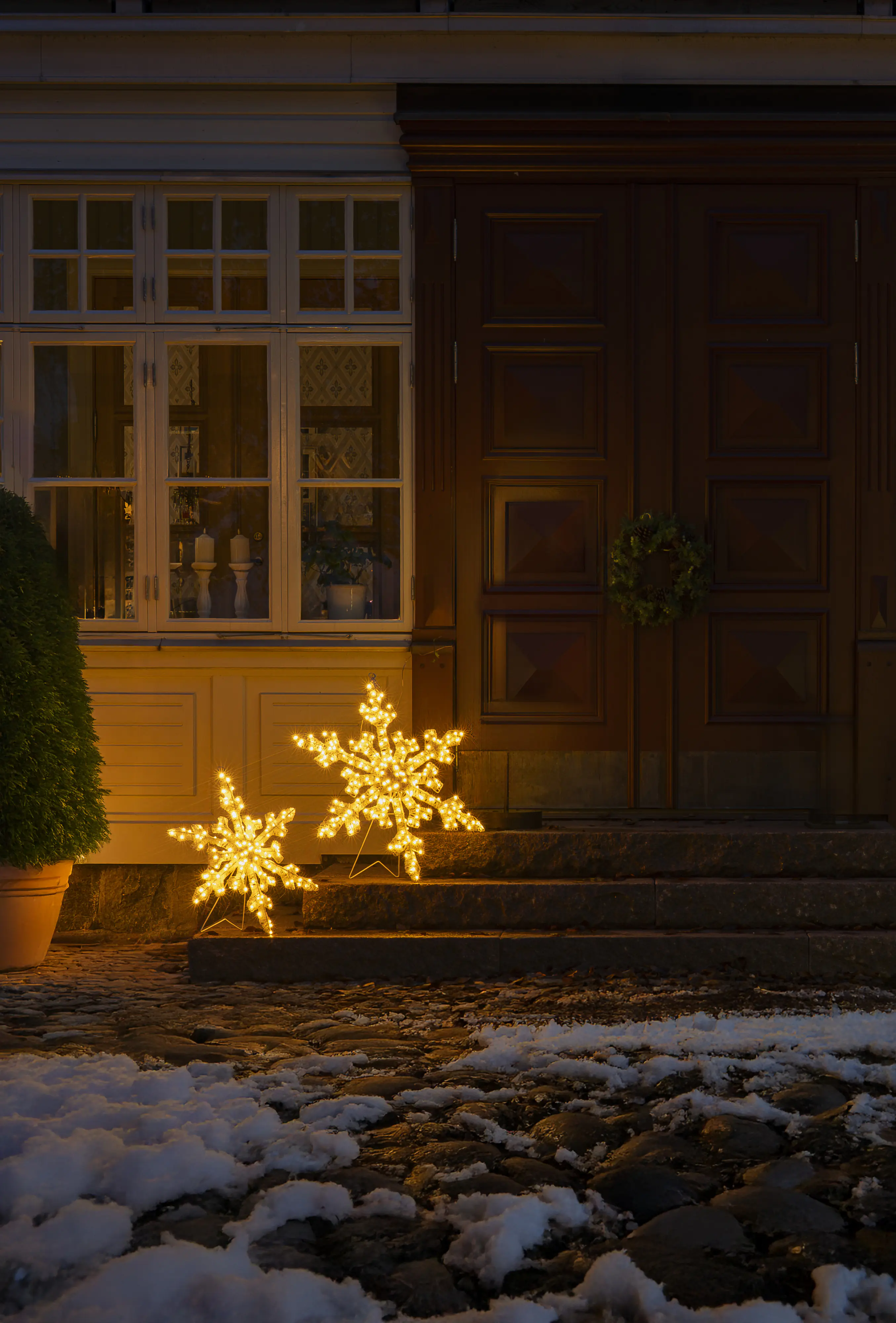 Konstsmide LED Weihnachtsdeko Schneeflocke 200 Dioden 80 cm bernstein